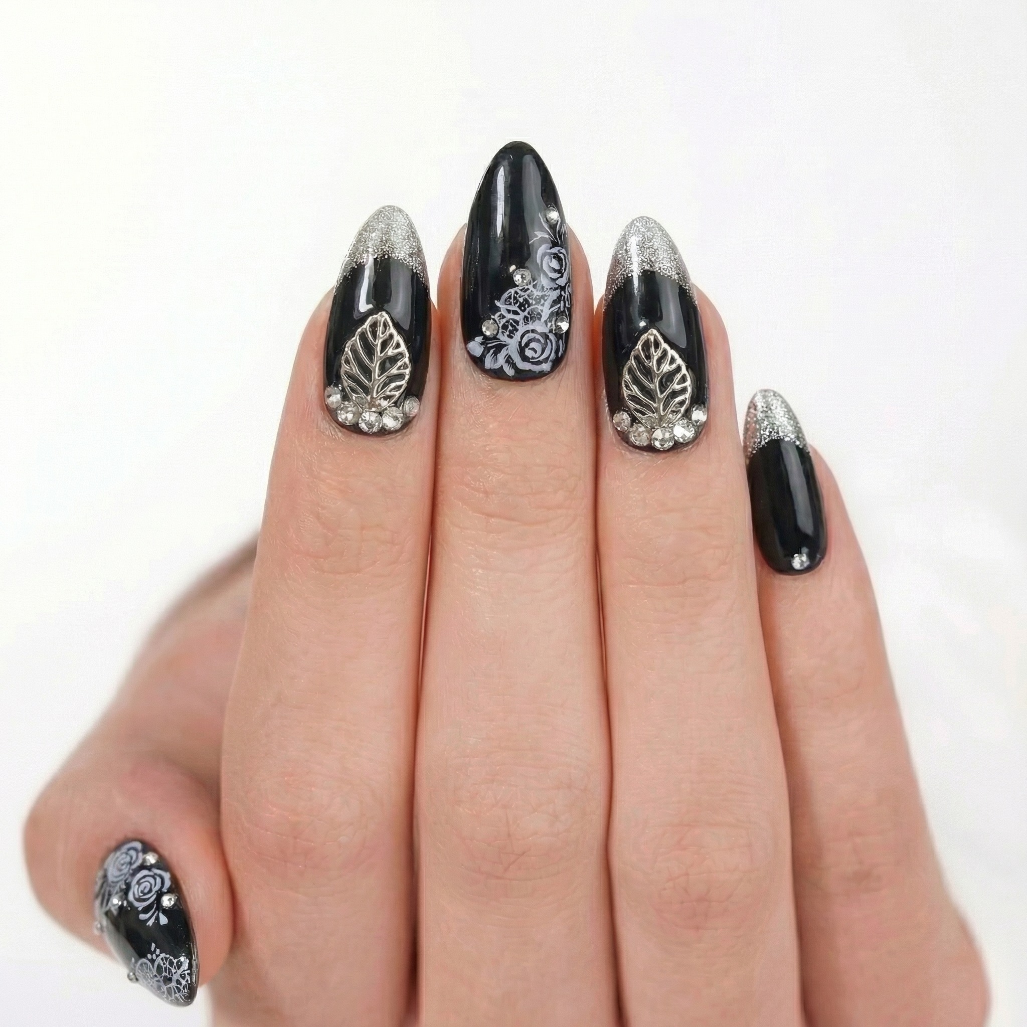 Black press-on nail with silver accents product photo - consistent catalog pose